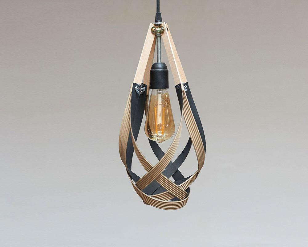 Lámpara Tonilight articulada cerrada sobre fondo gris