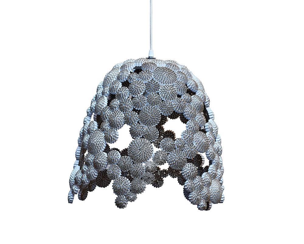 Lámpara de techo esta elaborada con espirales volumétricas de cartón de diferentes tamaños